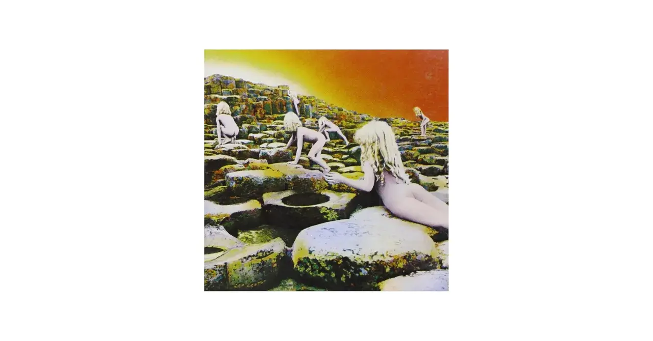 Couverture de Led Zeppelin, Houses of the Holy, avec des enfants nus sur des rochers sous un ciel orangé.