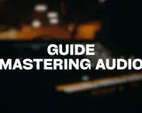 Guide pour maîtriser un son parfait. L'image montre un équipement audio flou, suggérant le processus de mastering.