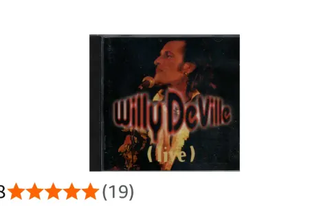 Pochette d'album live de Willy DeVille, avec le chanteur au micro. Un classique pour les amateurs de ses chansons.