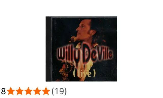 Pochette d'album live de Willy DeVille, avec le chanteur au micro. Un classique pour les amateurs de ses chansons.